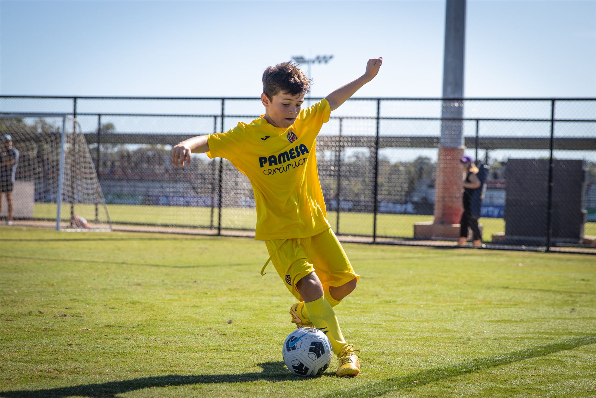 Vale player running with the ball, defenders chasing
