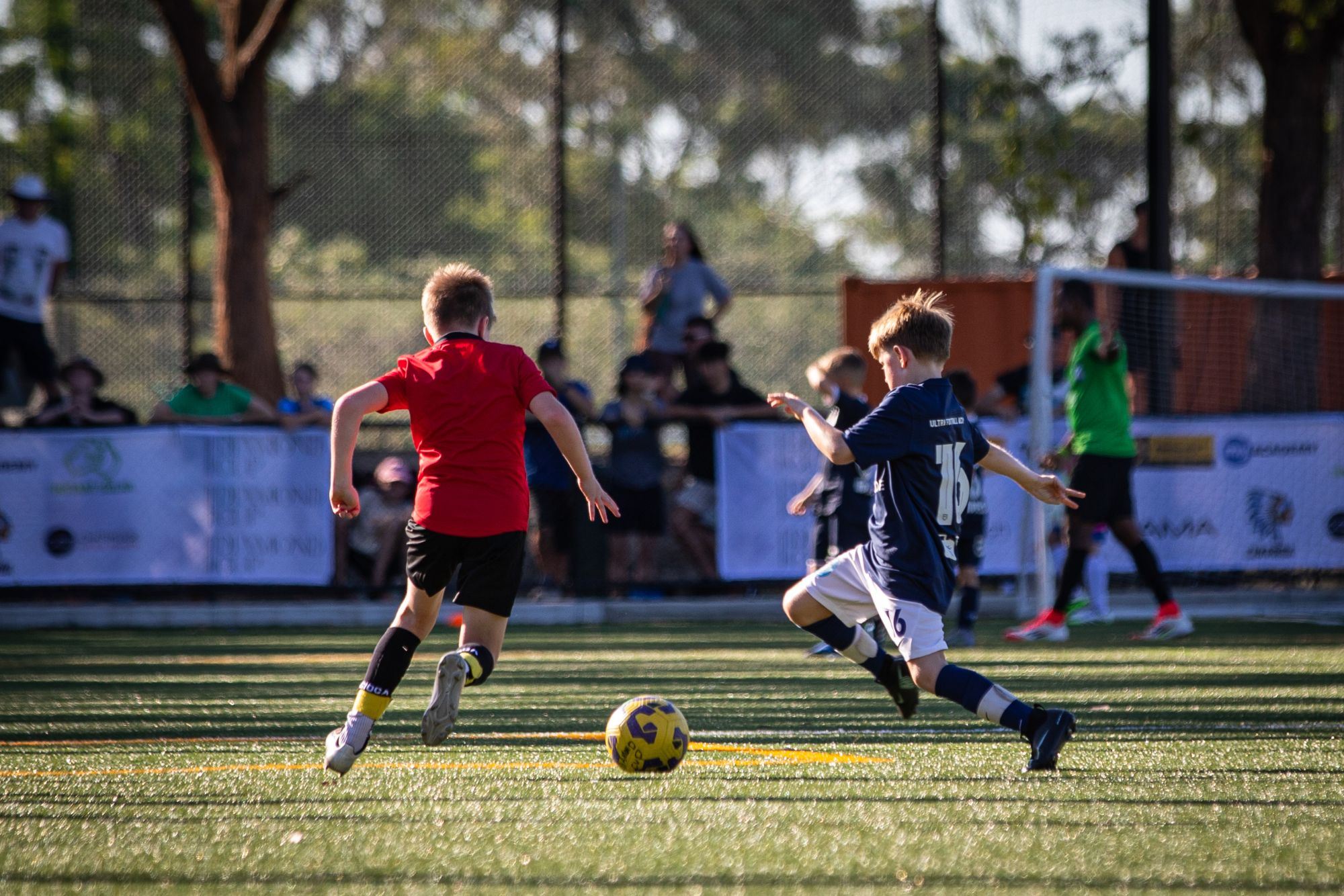 Player sprinting away in celebration, arms out